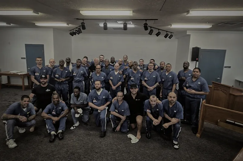 RTD Program class gathered together in the prison chapel with Frank Ortega and the ministry team