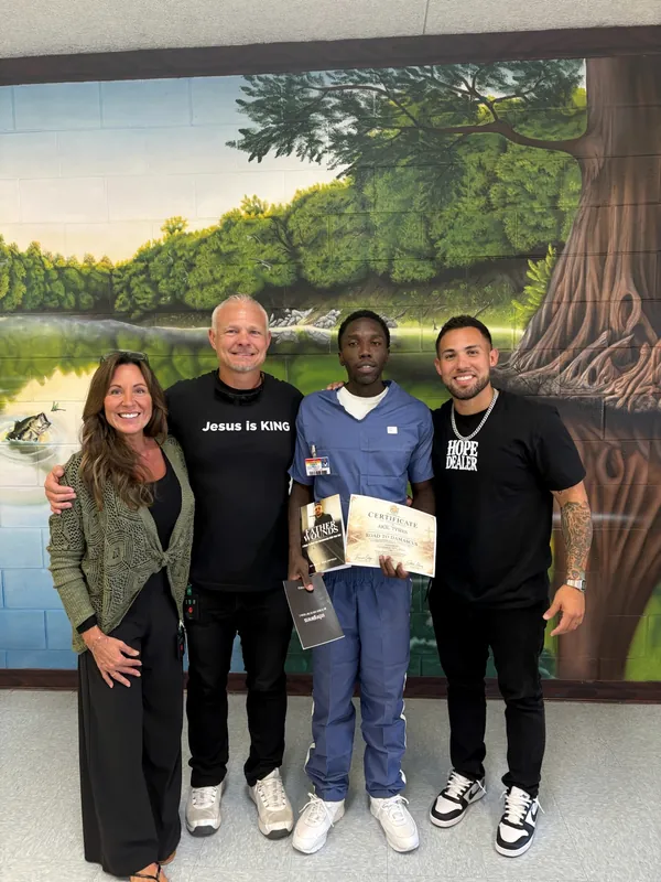 A Road to Damascus Class Two graduate standing with the MOG Ministries family